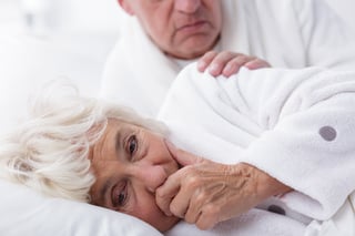 older_woman_coughing_in_bed.jpg